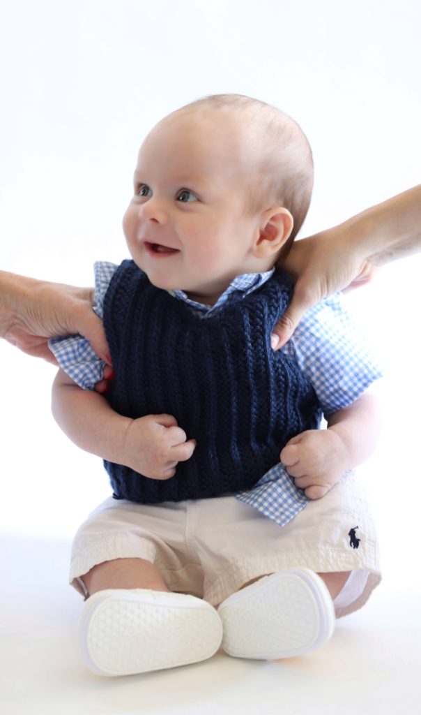 baby boy in crochet sweater