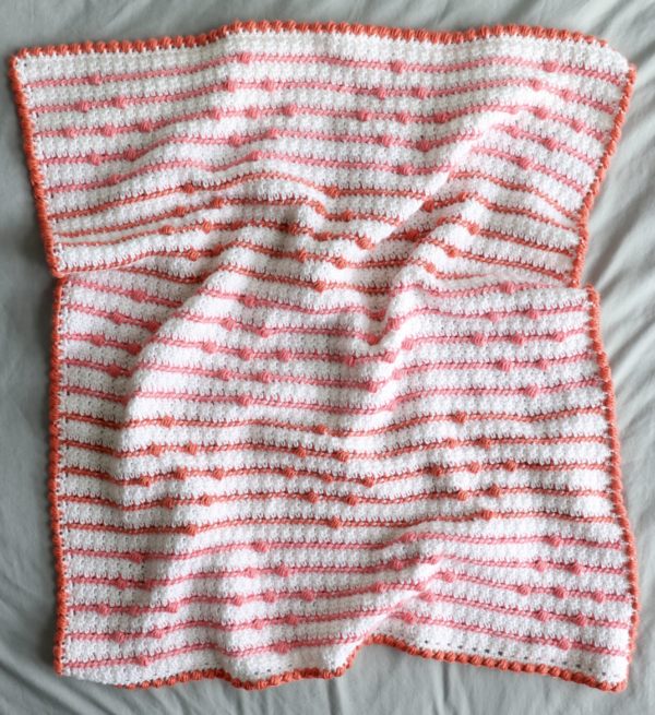 crochet blanket with stripes and bobbles