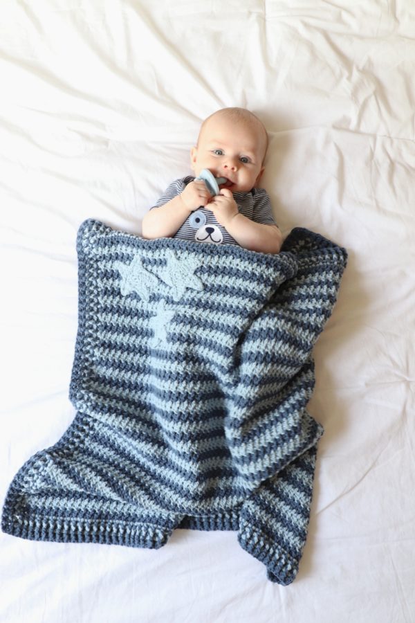 baby with crochet blanket