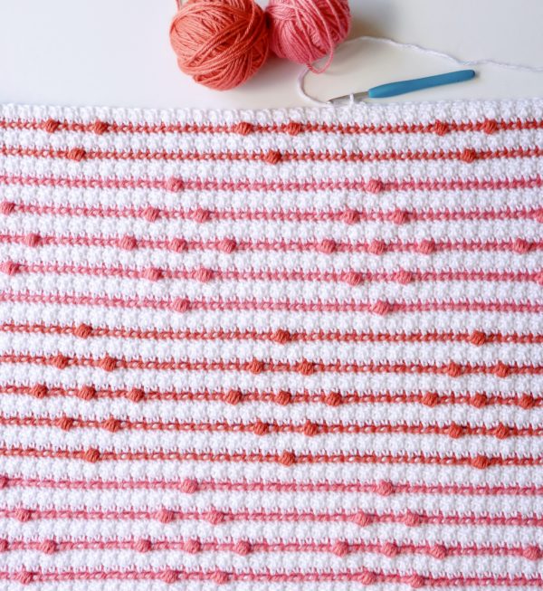 crochet blanket with stripes and bobbles