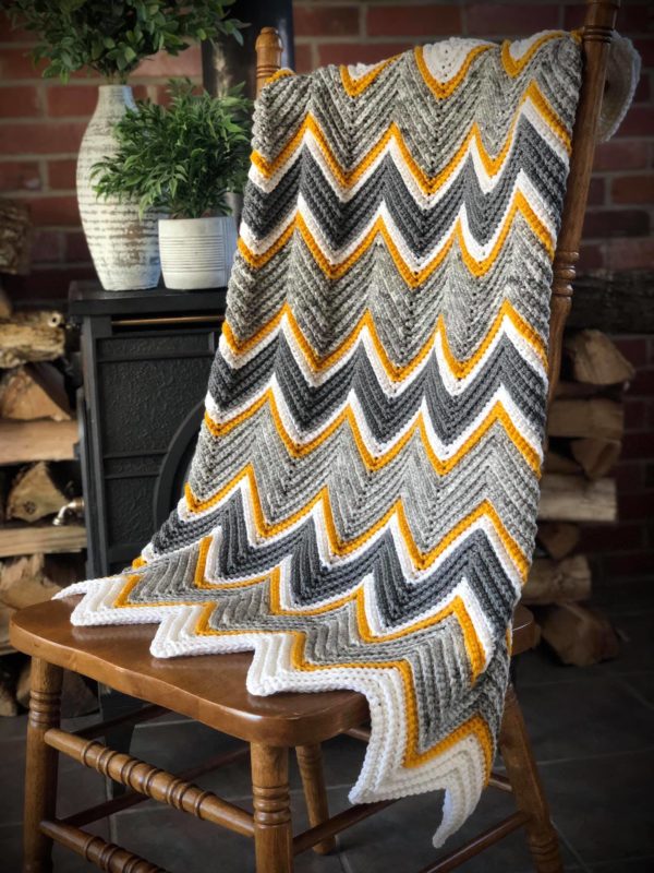 gray yellow white crochet chevron blanket