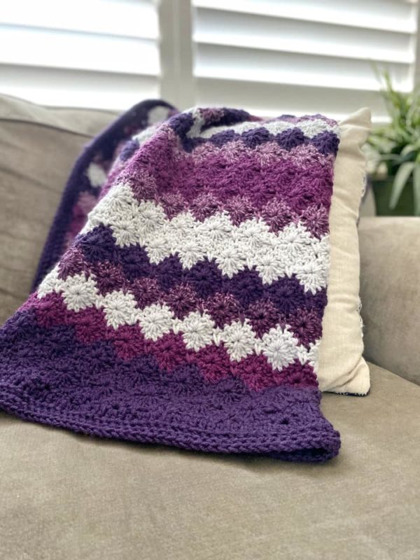crochet harlequin blanket on couch