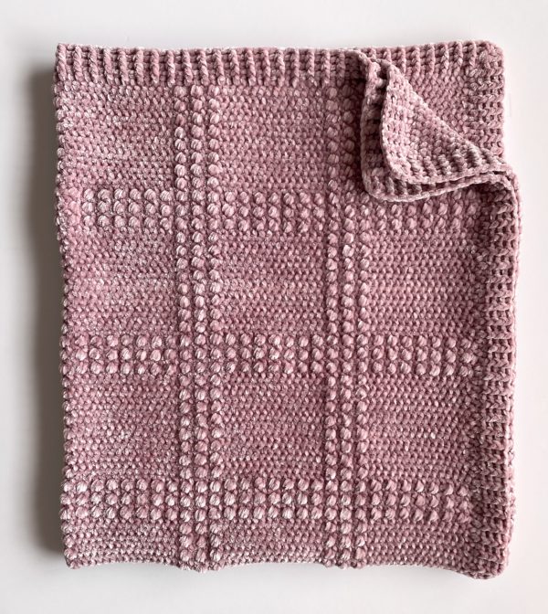 windowpane textured crochet blanket folded