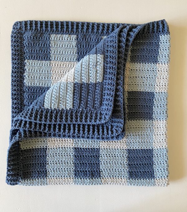 blue crochet gingham blanket folded