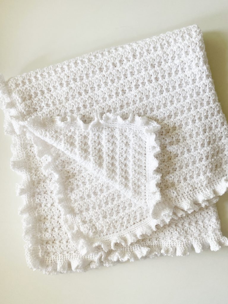 white crochet flower blanket