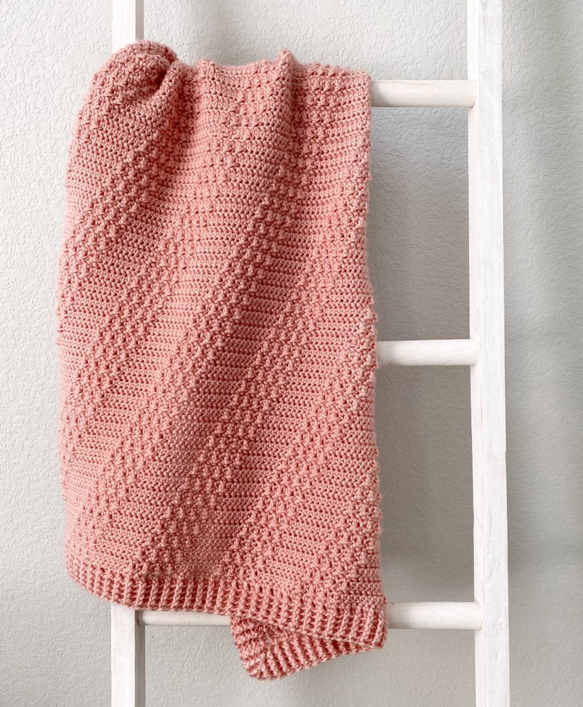 diagonal stripes textured crochet blanket on ladder