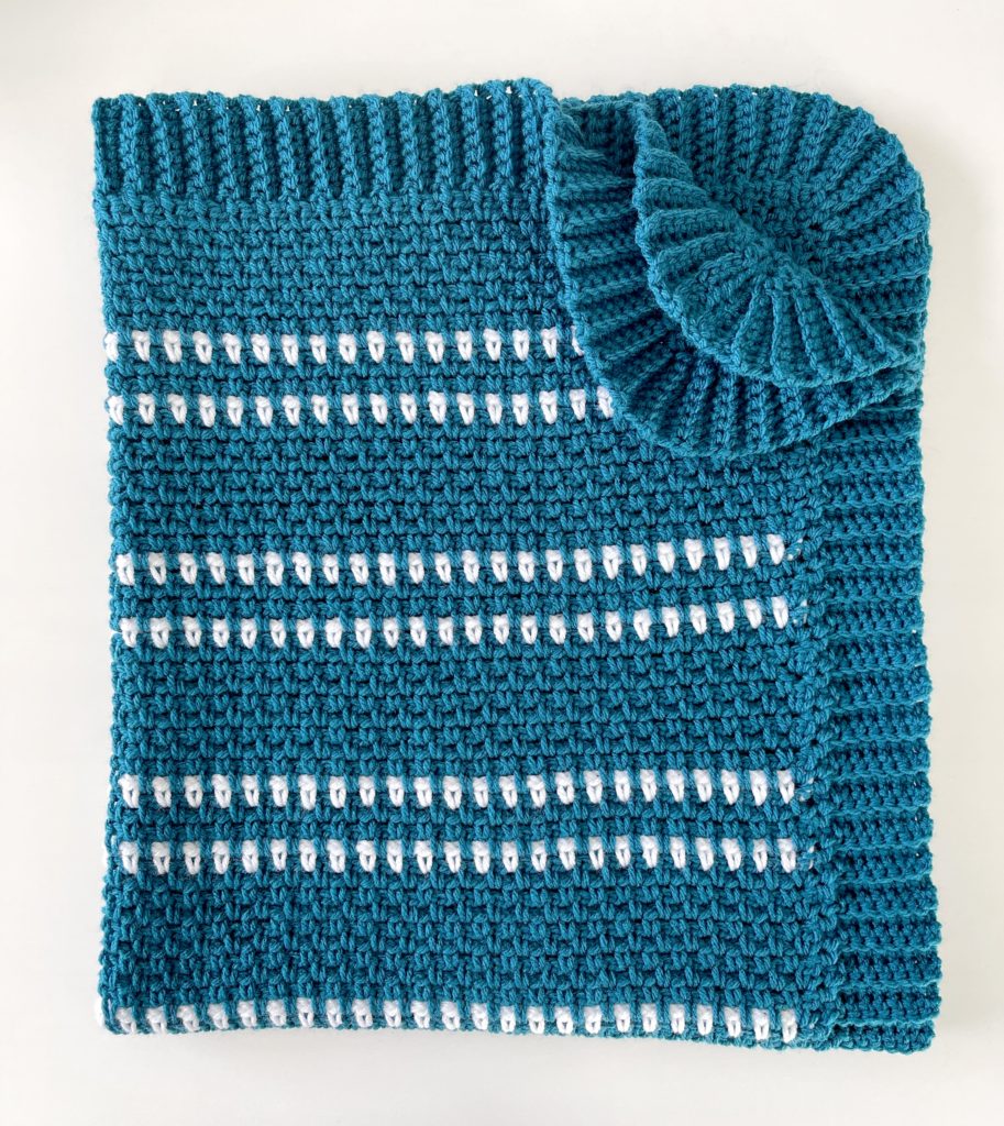 teal moss stitch crochet blanket folded