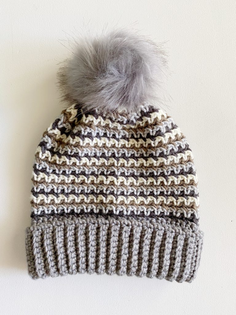 crochet hat with fur pom pom