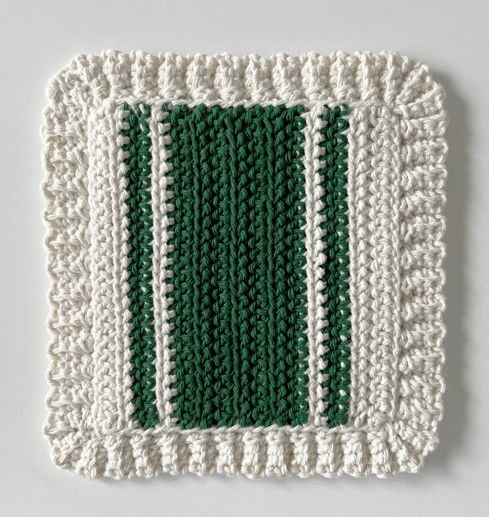 crochet white hot pad with green stripes