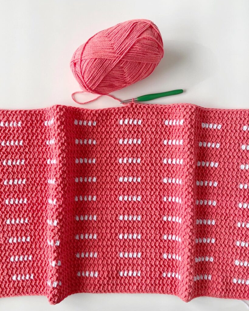 pink and white crochet blanket work in progress