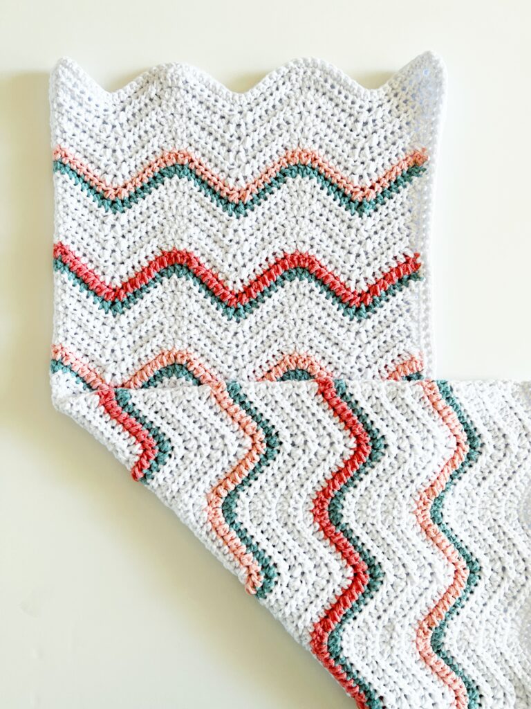 crochet white ripple blanket with colorful stripes