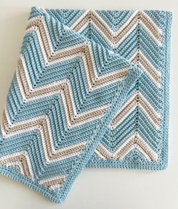 crochet blanket in blue and tan