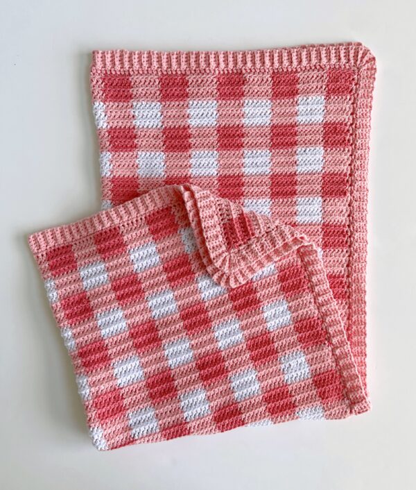 pink gingham blanket folded