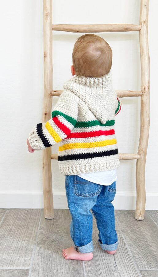 baby in striped sweater