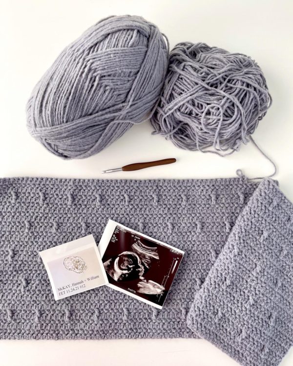 crochet blanket in progress with ultrasound picture