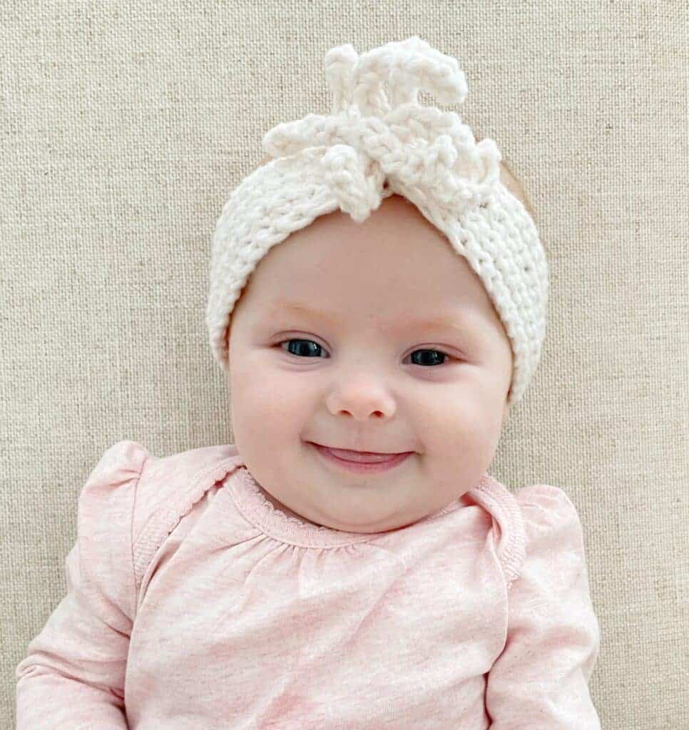 baby wearing crochet headband