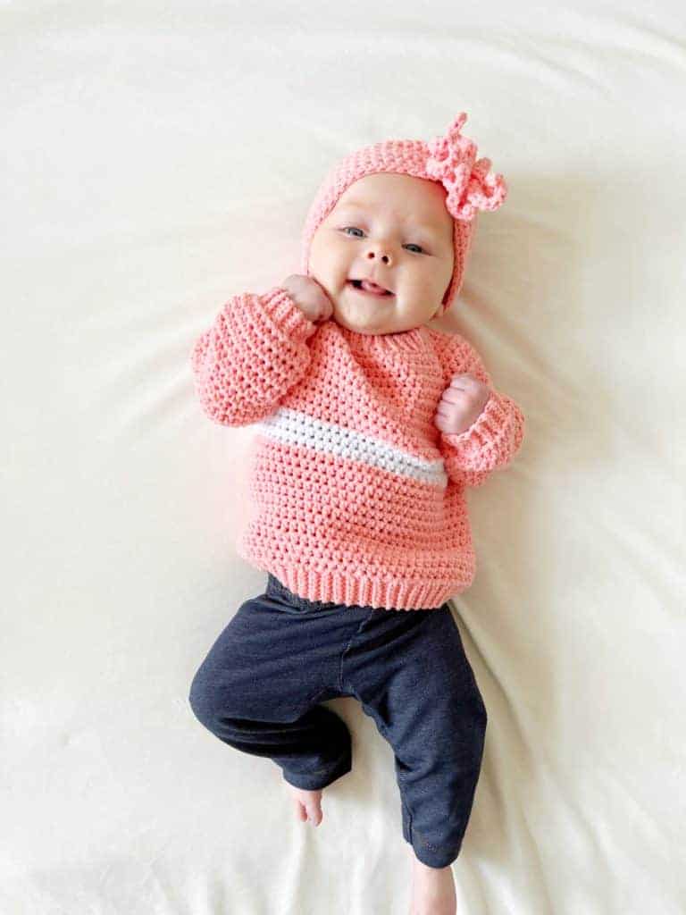 baby in pink sweater