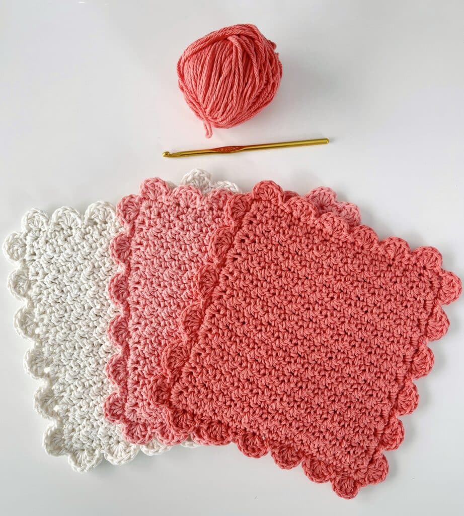 three hot pads with skein of yarn and hook