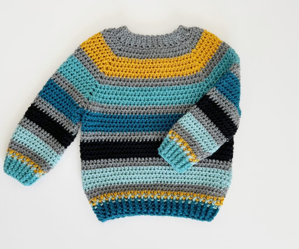 striped sweater in teal, black, gray and gold