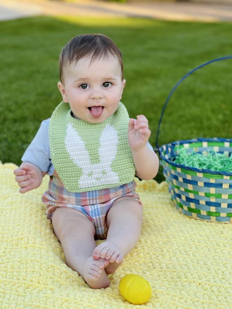 baby boy wearing crochet bib with bunny 