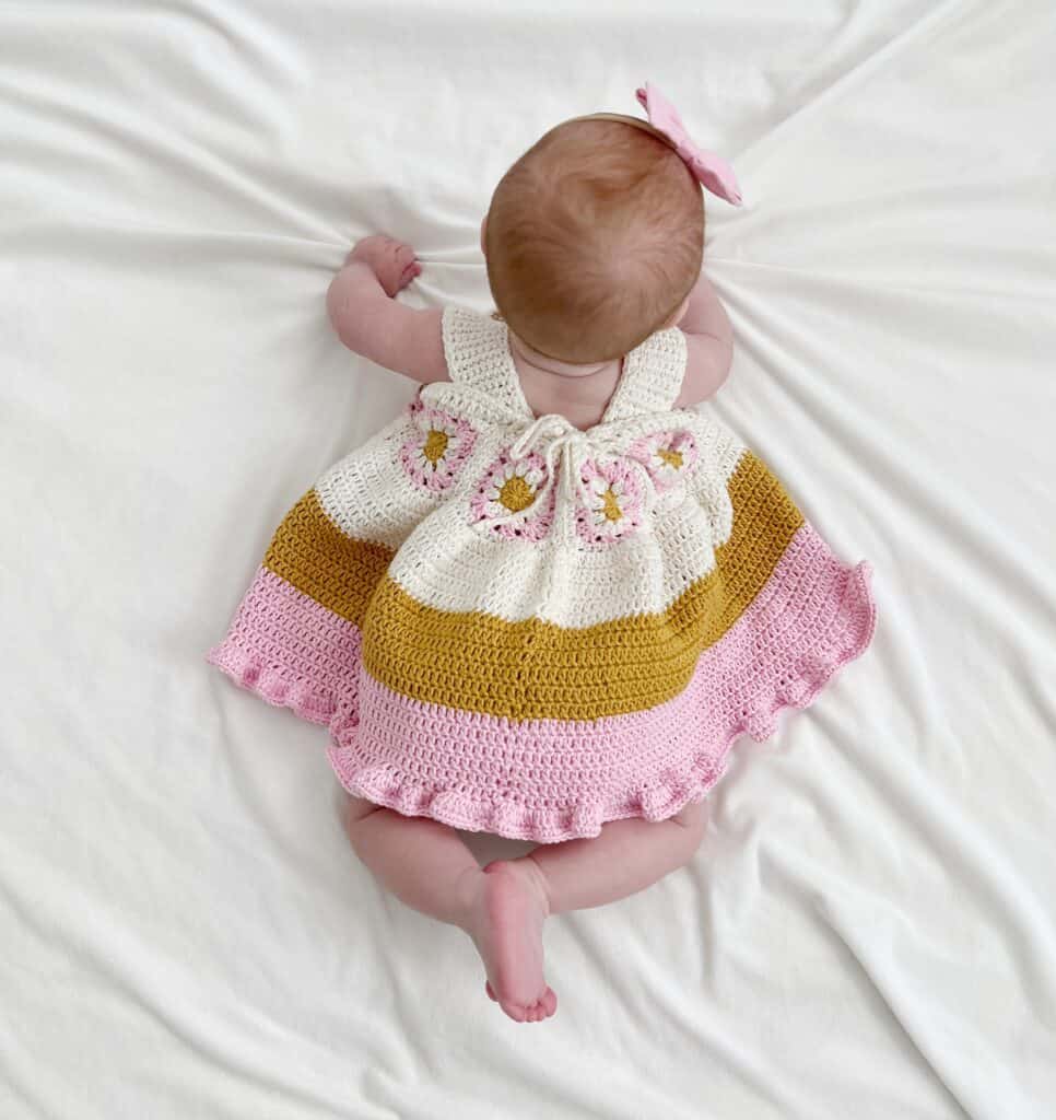 baby wearing crochet dress