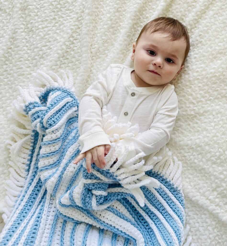 Baby with crochet Blanket