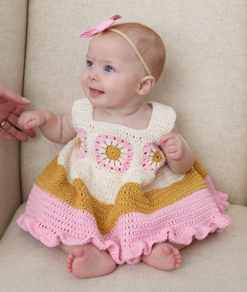 baby wearing crochet dress