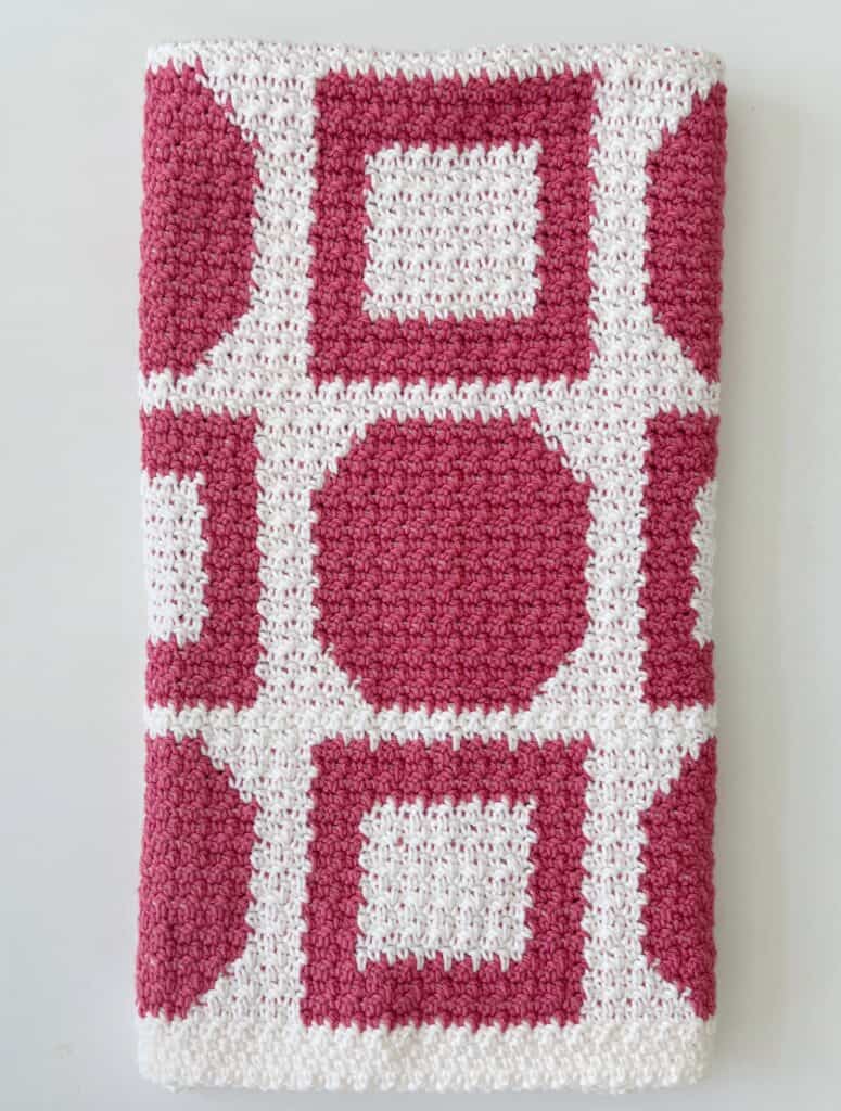 pink and white crochet blanket