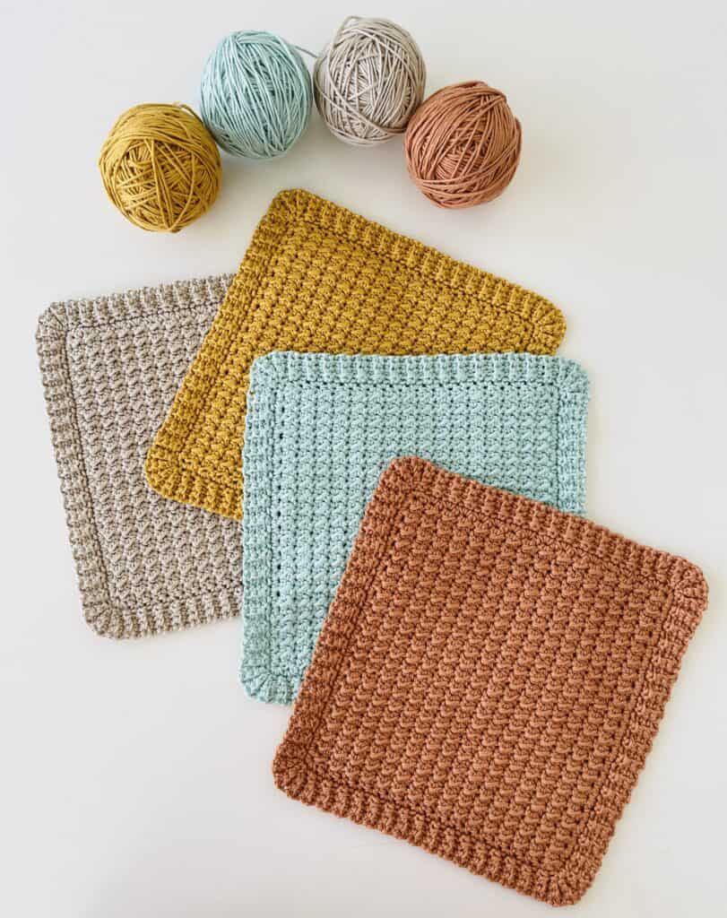 4 crochet dishcloths with 4 balls of yarn