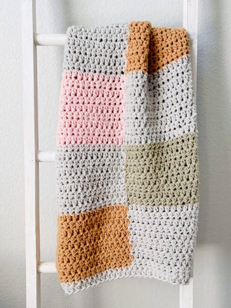 crochet blanket on ladder