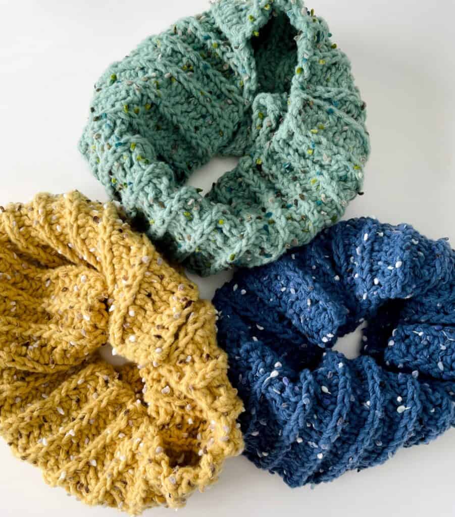 green, yellow, and blue scarfs