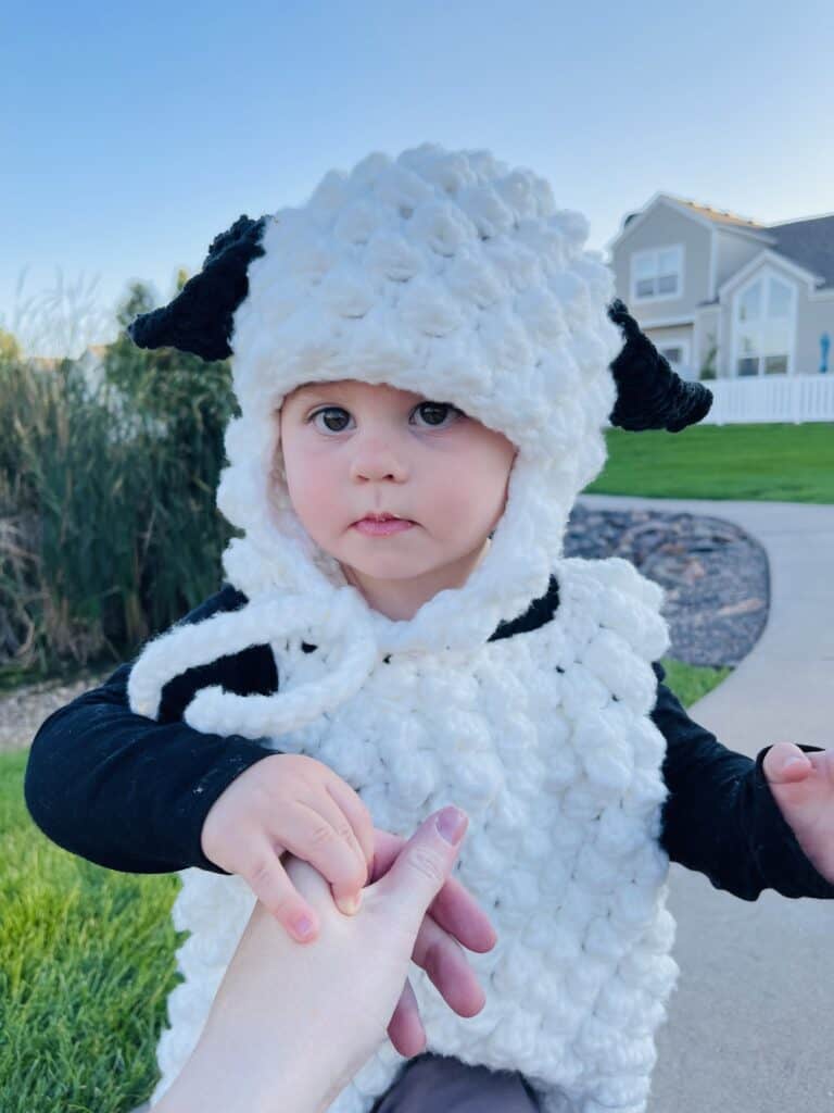 Baby boy wearing sheep costume