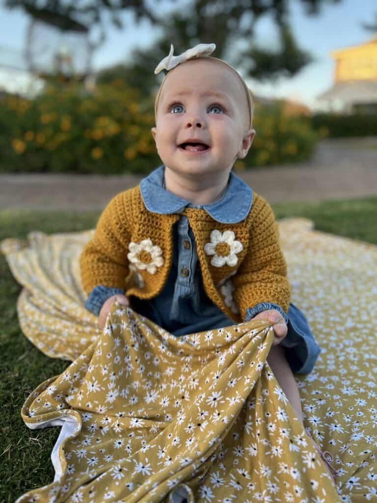 baby girl with crochet sweater