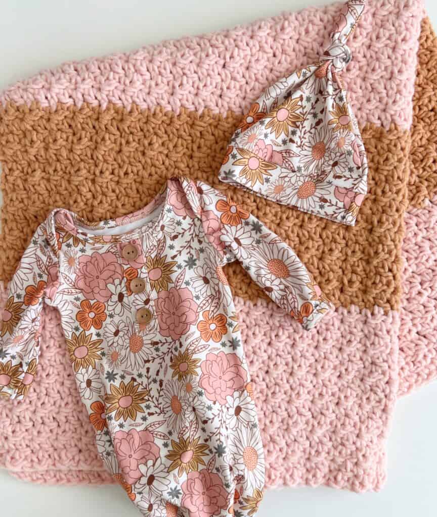 Crochet blanket with floral baby hat and nightgown