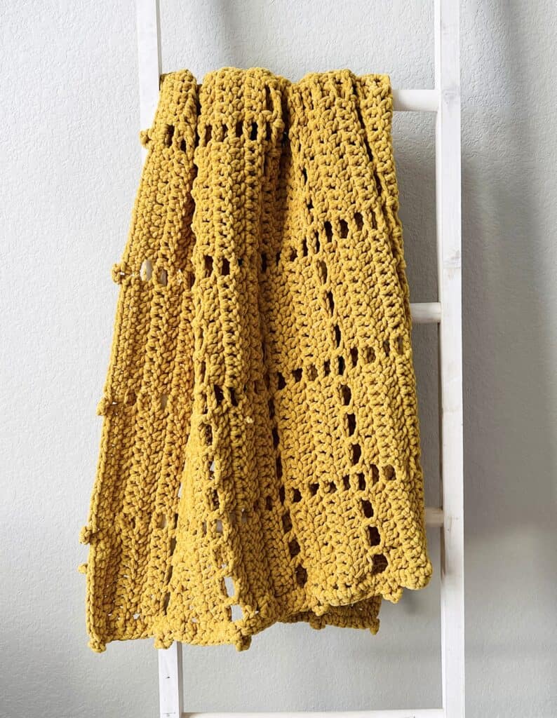 crochet blanket on ladder