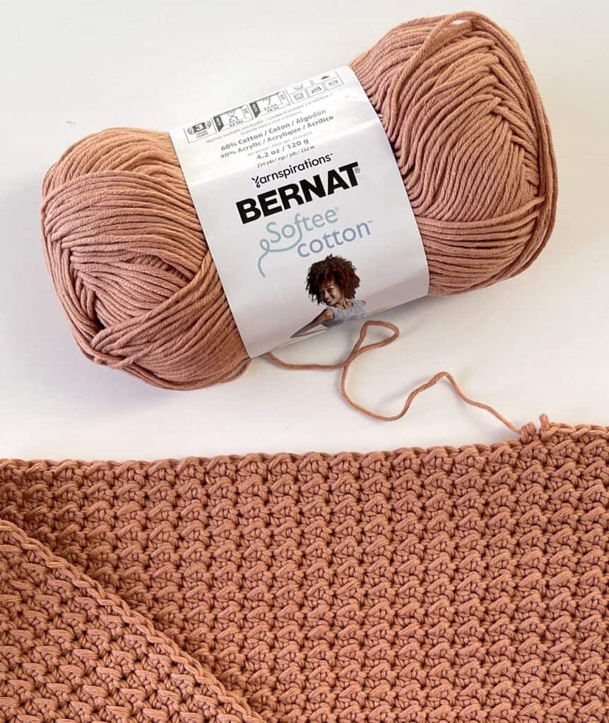 yarn skein with crochet blanket