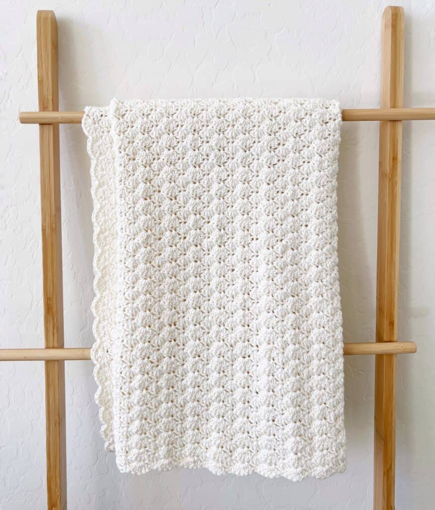 crochet blanket on a ladder