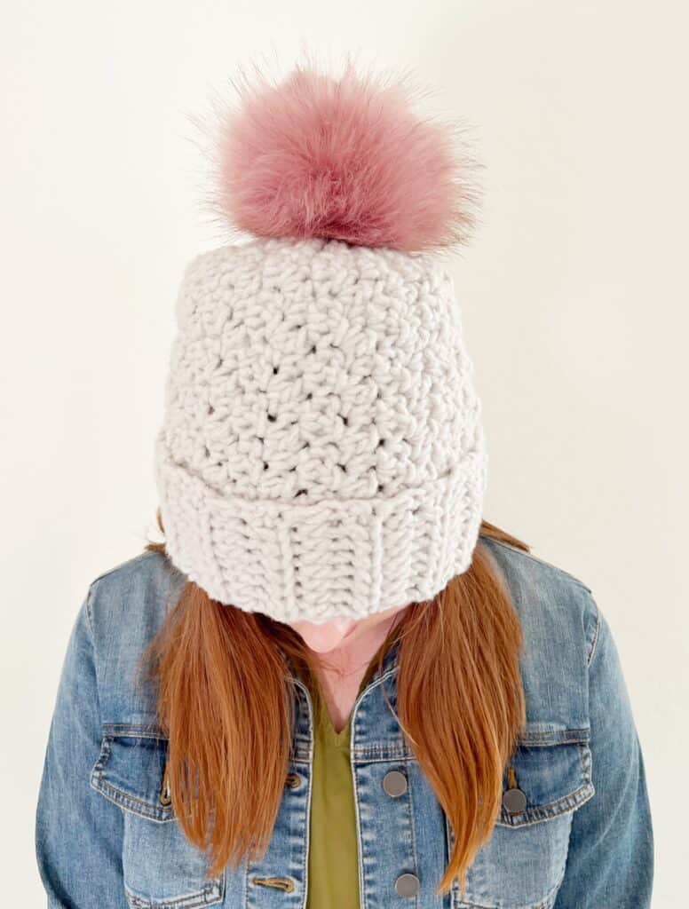 woman wearing griddle stitch crochet hat 