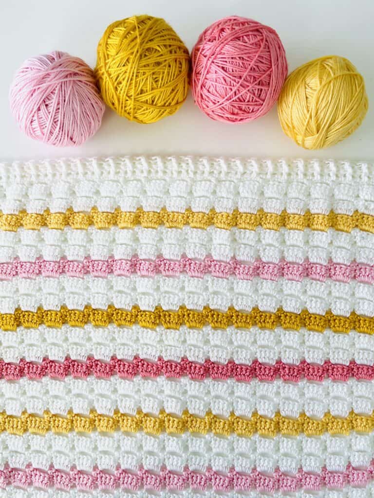 Crochet blanket with 4 yarn balls 