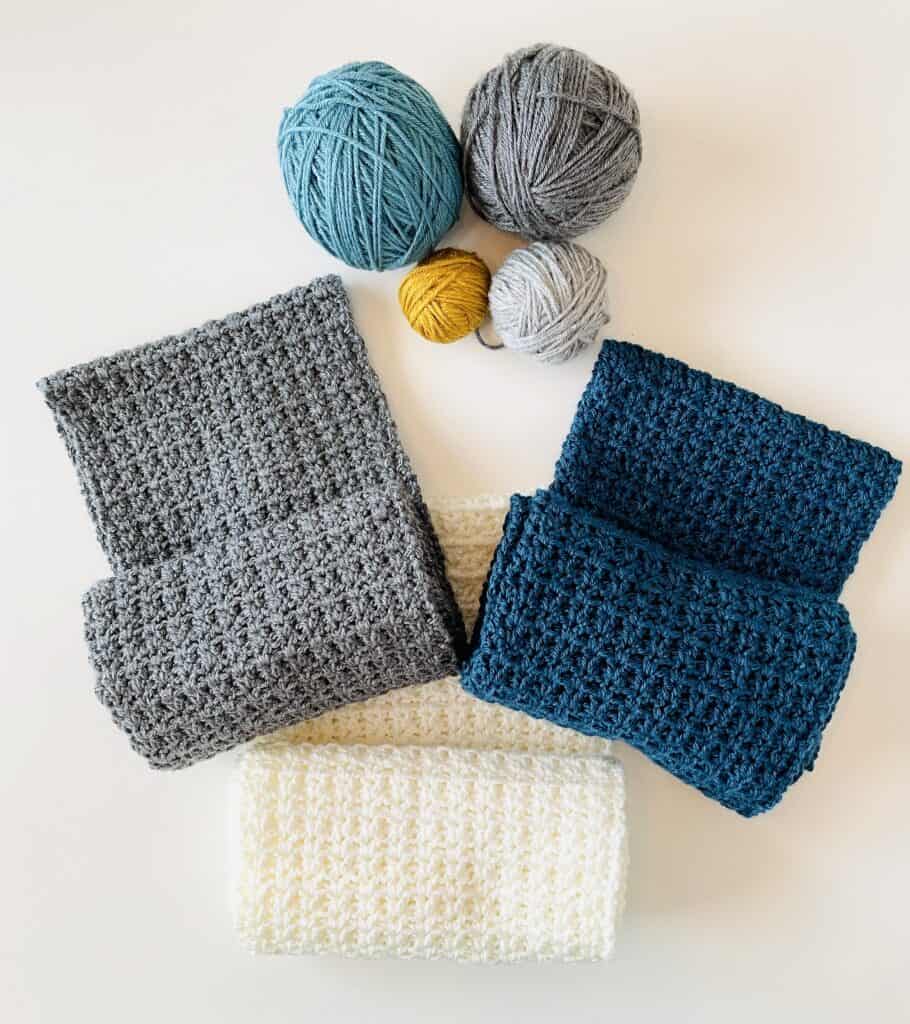 three scarves and 4 yarn balls