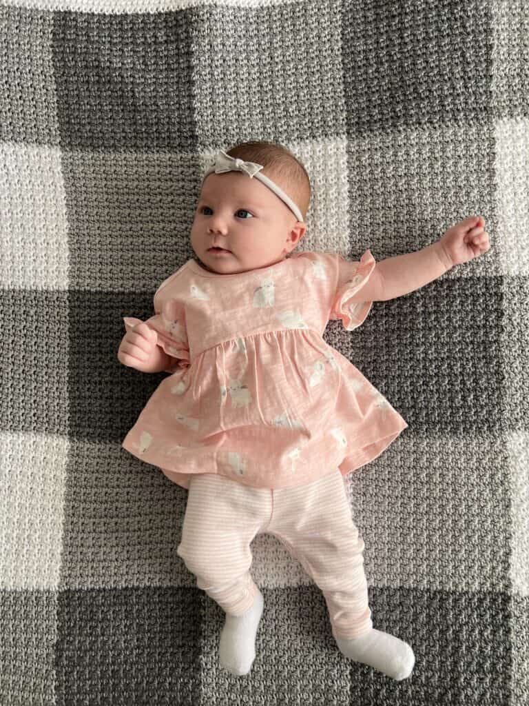 Baby Nora on crumpled griddle gingham blanket