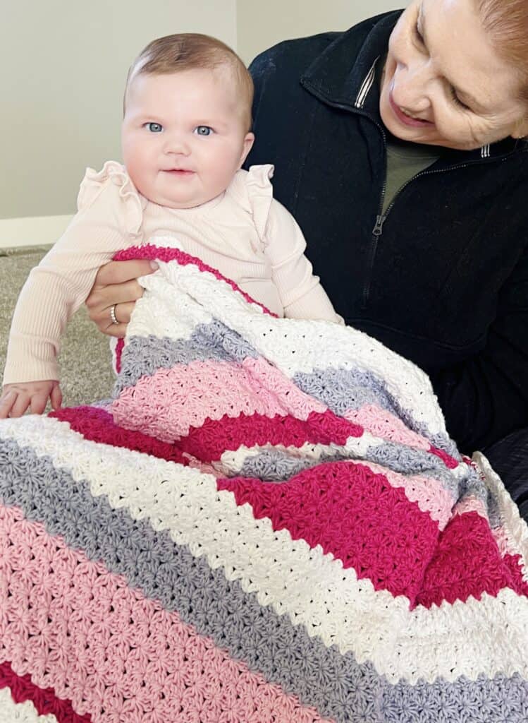  Baby girl with crochet blanket