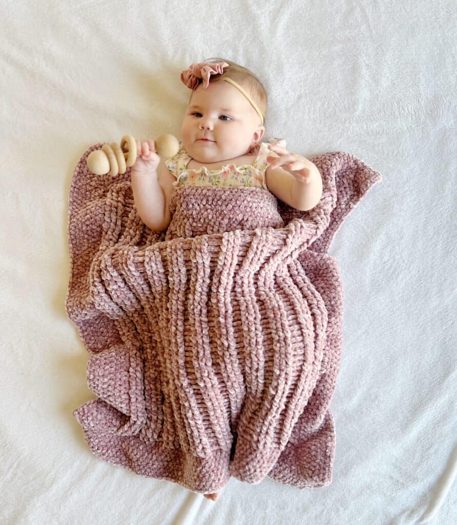 baby Nora with crochet blanket