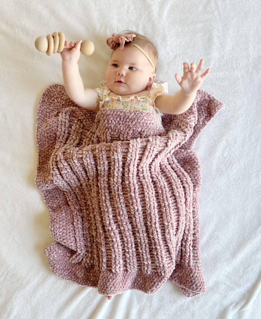 Baby Nora with crochet blanket