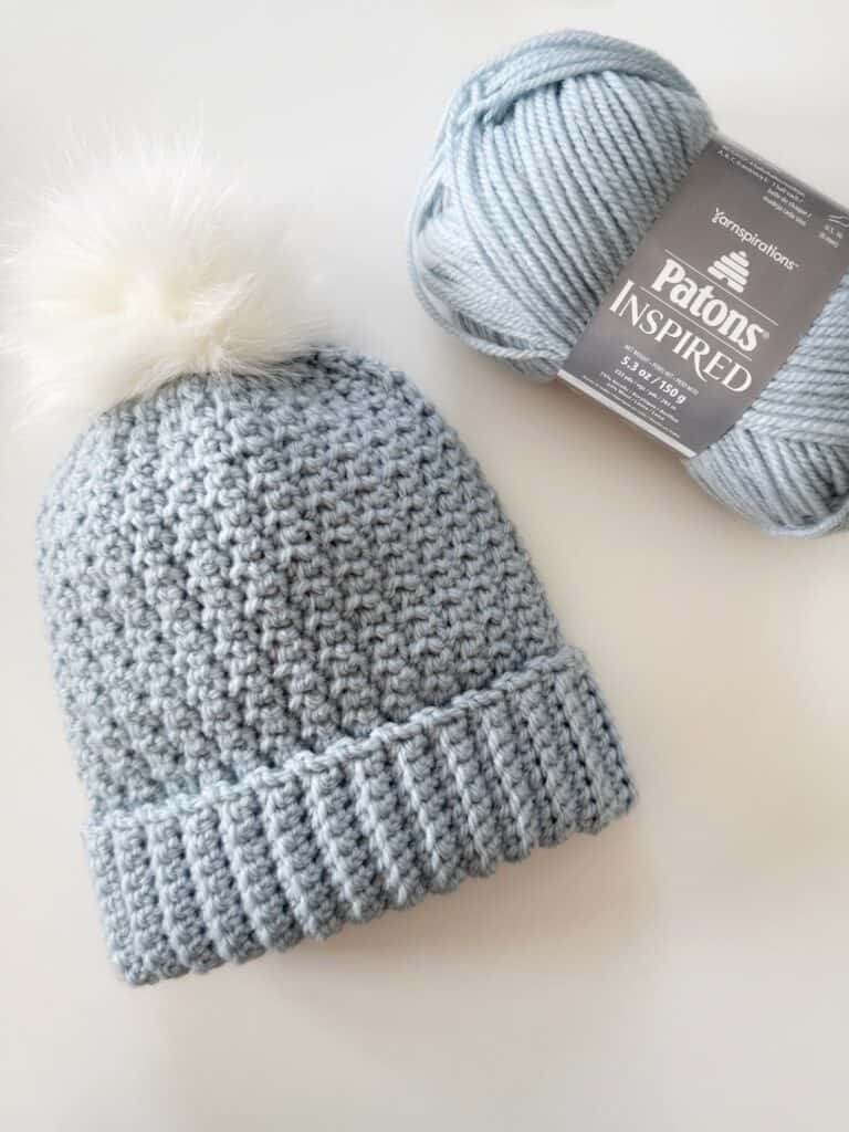 Blue Crochet hat with skein of yarn