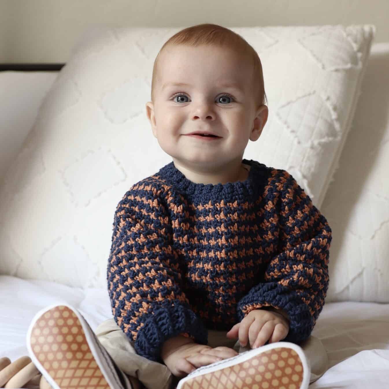 baby boy wearing crochet sweater