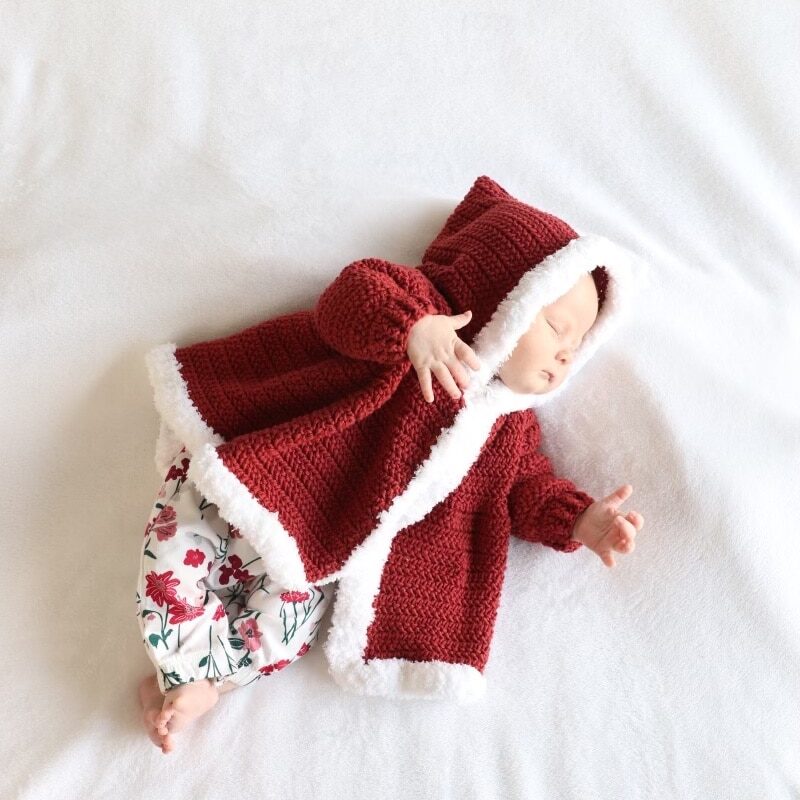 baby in red coat with white trim