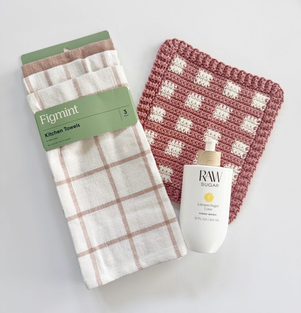 crochet dishcloth, kitchen towels, bottle of hand soap